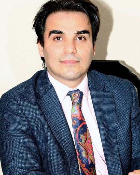Portrait of Dr. S. Nouri Rafiee, physician and medical educator.